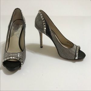 Michael Koran’s snakeskin print heels with studs.